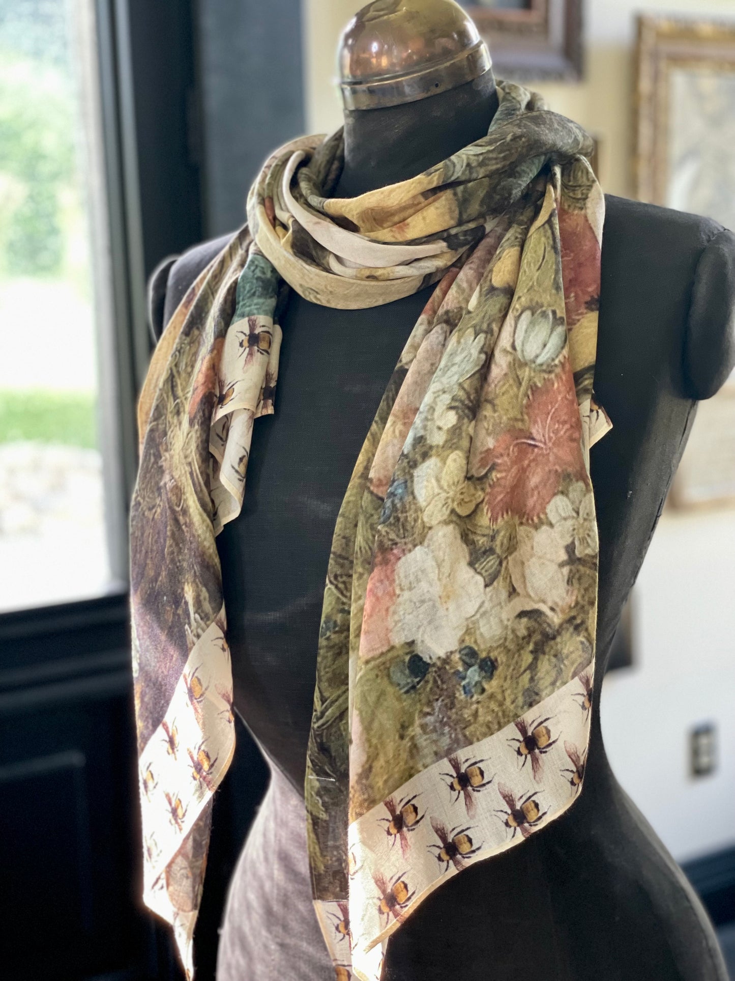 Model wearing the I Dream in Flowers Scarf featuring lush floral art by Jan Brueghel and charming Victorian bumblebees – Market of Stars.