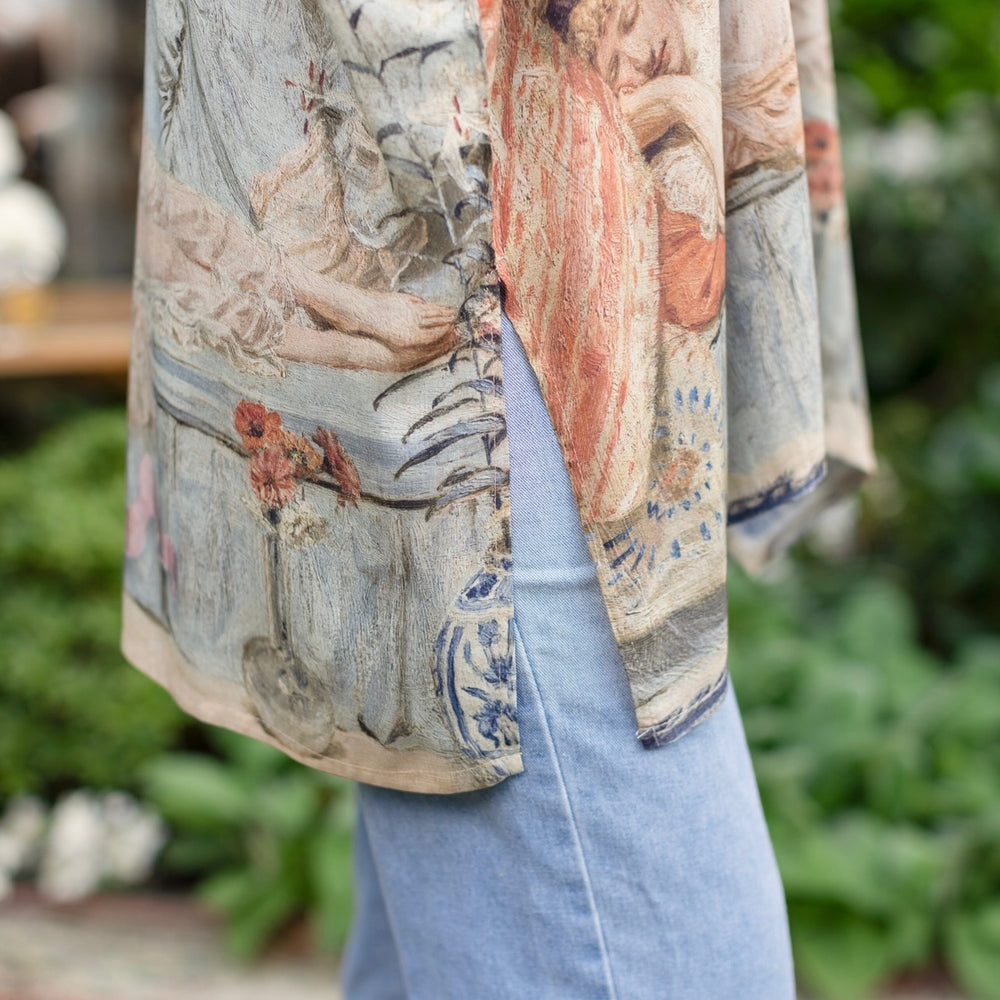 
                  
                    Model wearing the Imaginarium matinee duster featuring a dreamy collage of historic art, candle chandelier, and sleeping muse inspired by Victorian paintings – Market of Stars
                  
                