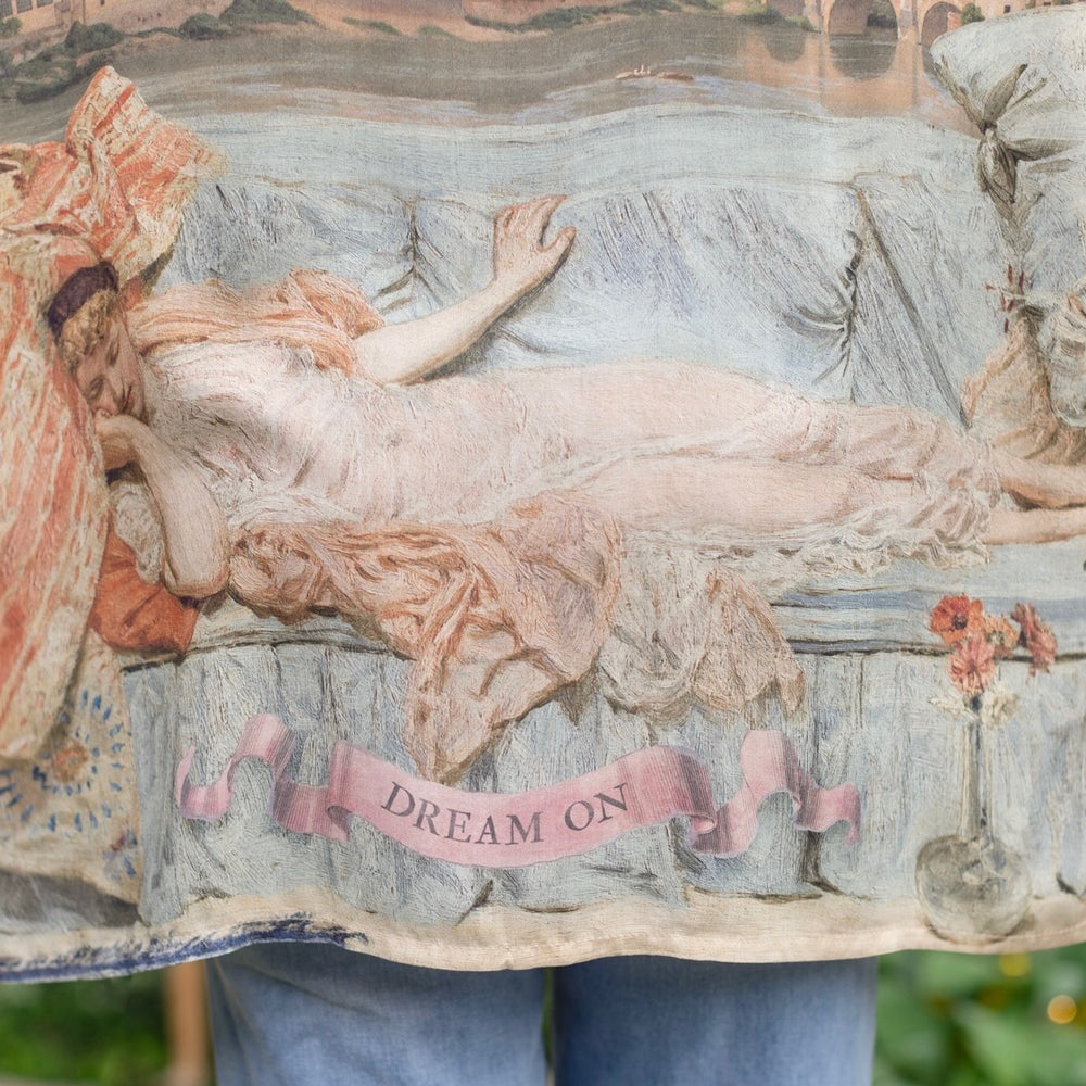
                  
                    Model wearing the Imaginarium matinee duster featuring a dreamy collage of historic art, candle chandelier, and sleeping muse inspired by Victorian paintings – Market of Stars
                  
                