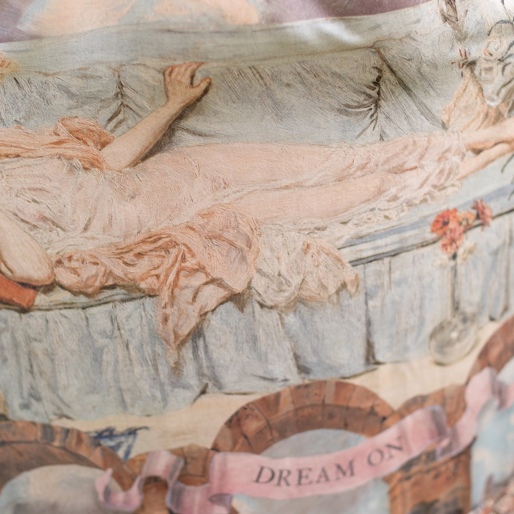 
                  
                    Model wearing the Imaginarium Bohéme Slip Dress featuring a dreamy layered print of historic landscapes, chandeliers, and a sleeping muse – Market of Stars.
                  
                