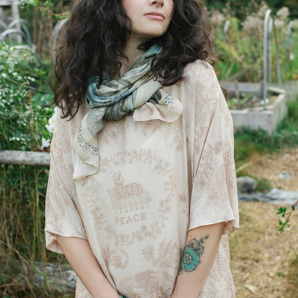 
                  
                    Delicate Land of Plenty scarf featuring pastoral Dutch landscapes, vintage cross-stitch details, and peaceful cottagecore vibes – Market of Stars.
                  
                