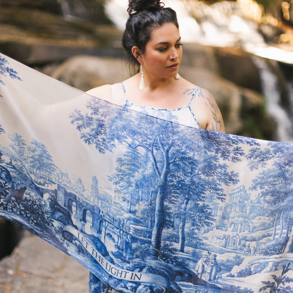 Let the Light In airy bamboo viscose scarf featuring print of Delft blue and white pottery, and positive message of light and hope - Market of Stars