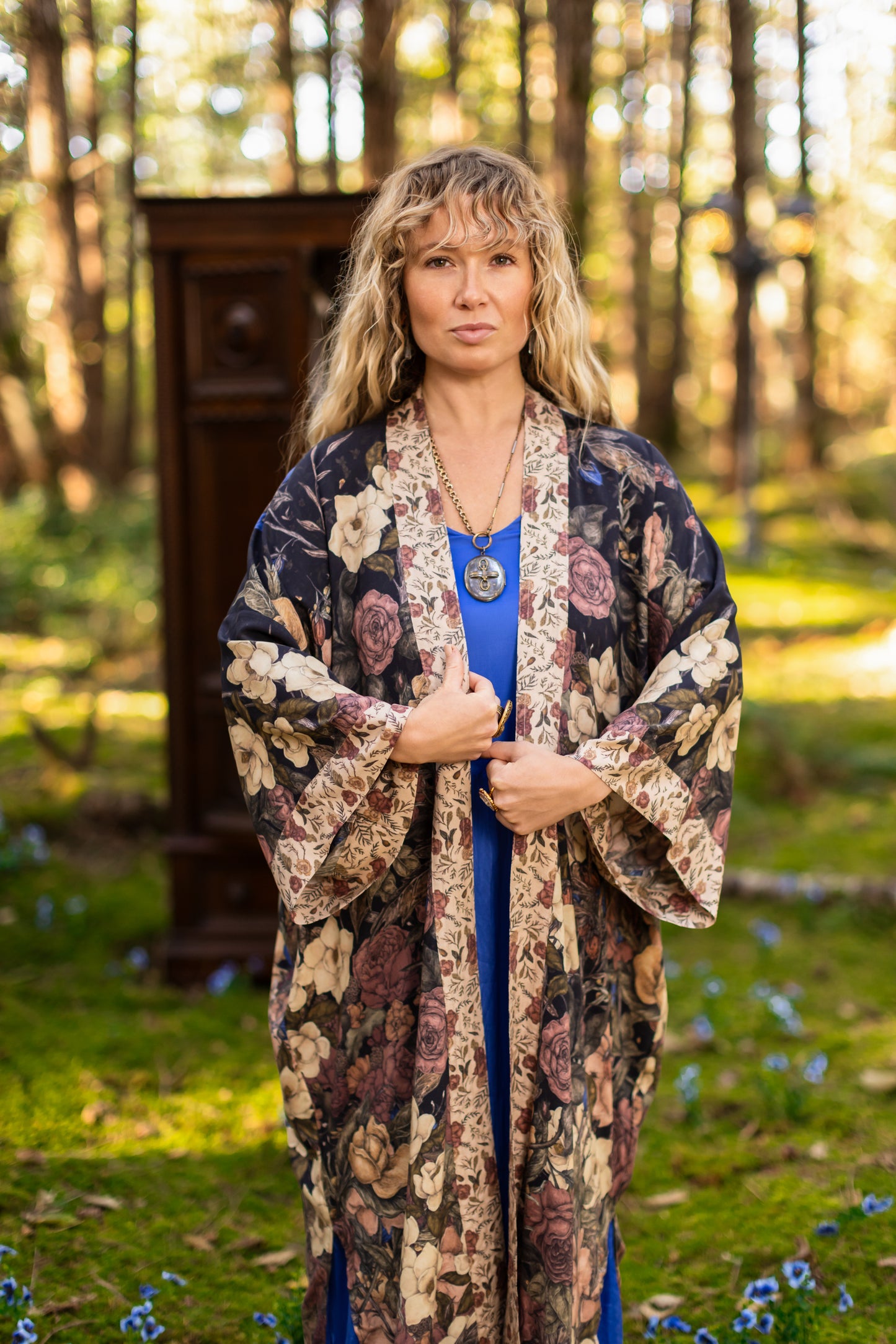Model wearing a full-length floral duster ft. artwork by artist & illustrator Jessica Roux - Market of Stars
