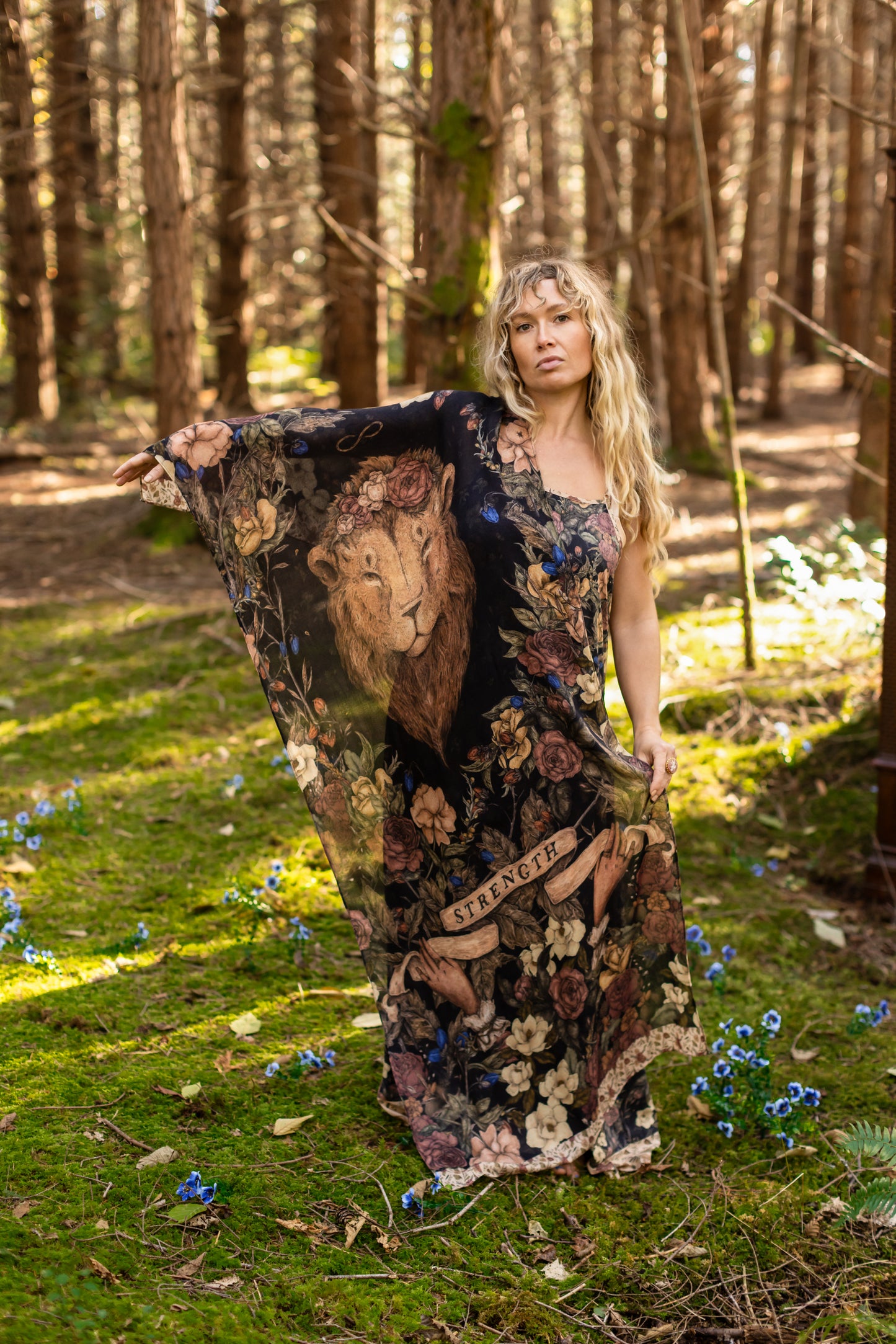 Model wearing a bamboo viscose scarf ft. artwork by artist & illustrator Jessica Roux - Market of Stars