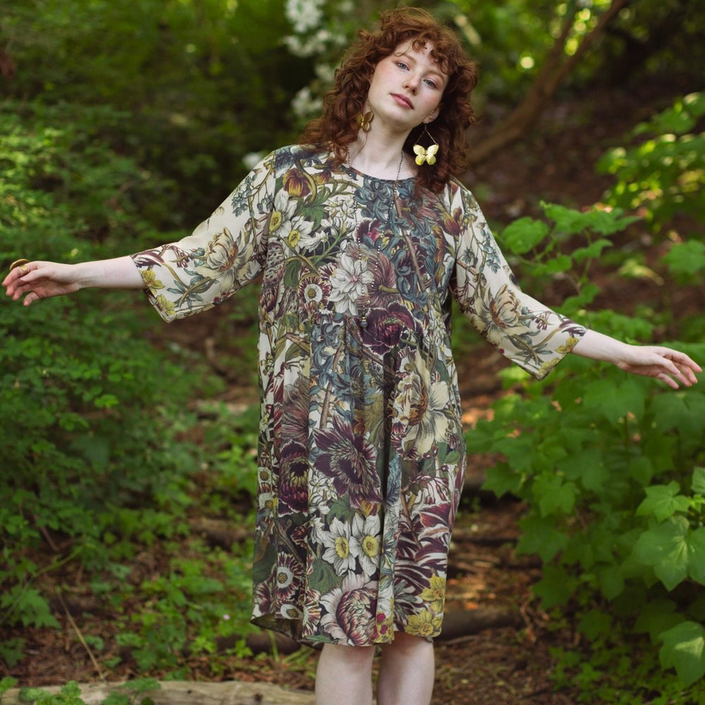 Model styled in Love Grows Wild Artist Dress featuring hand-coloured 1700s floral etchings and bumblebee detail – inspired by the French chemise – Market of Stars