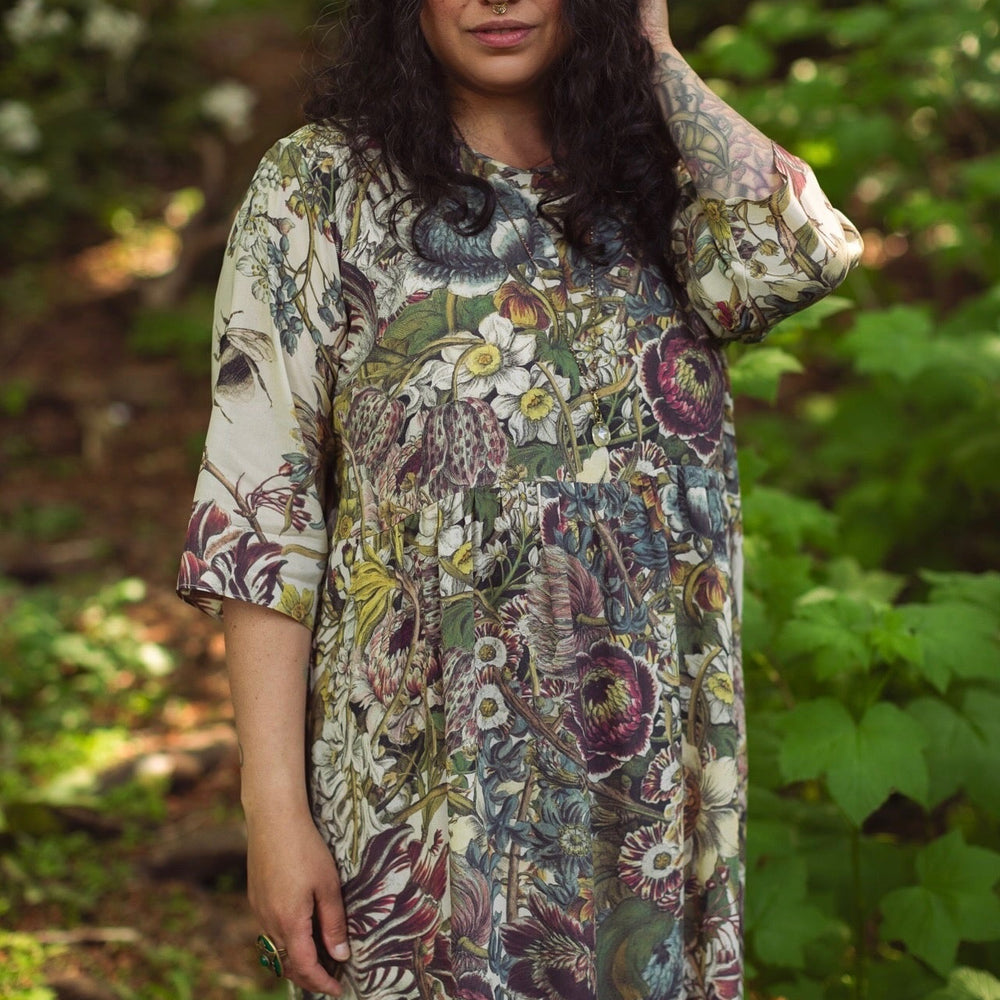 
                  
                    Model styled in Love Grows Wild Artist Dress featuring hand-coloured 1700s floral etchings and bumblebee detail – inspired by the French chemise – Market of Stars
                  
                