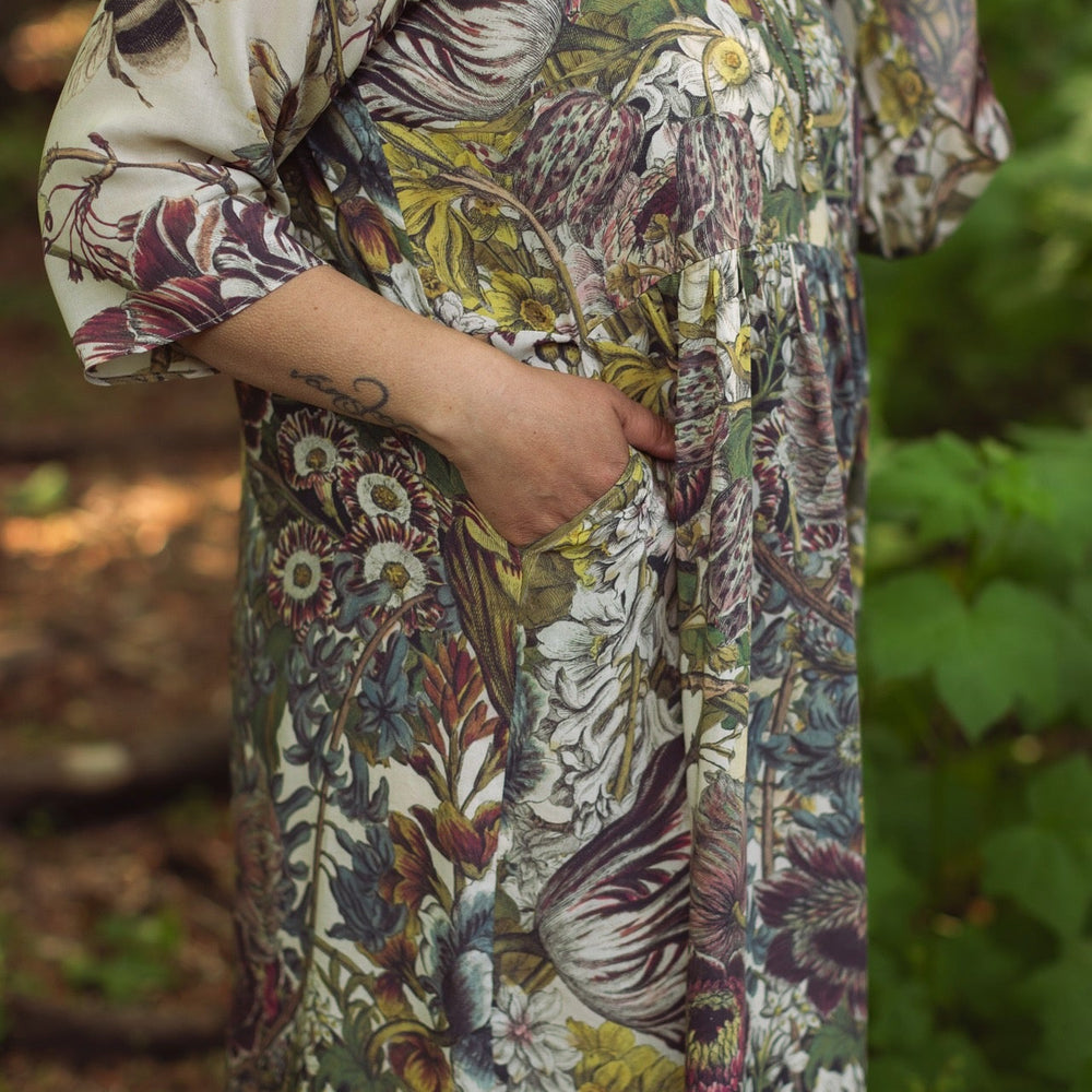 
                  
                    Model styled in Love Grows Wild Artist Dress featuring hand-coloured 1700s floral etchings and bumblebee detail – inspired by the French chemise – Market of Stars
                  
                