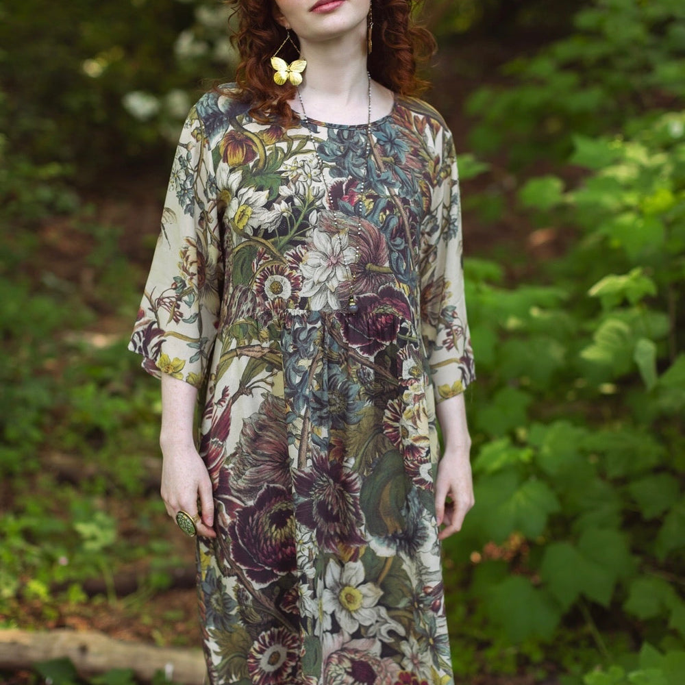 
                  
                    Model styled in Love Grows Wild Artist Dress featuring hand-coloured 1700s floral etchings and bumblebee detail – inspired by the French chemise – Market of Stars
                  
                