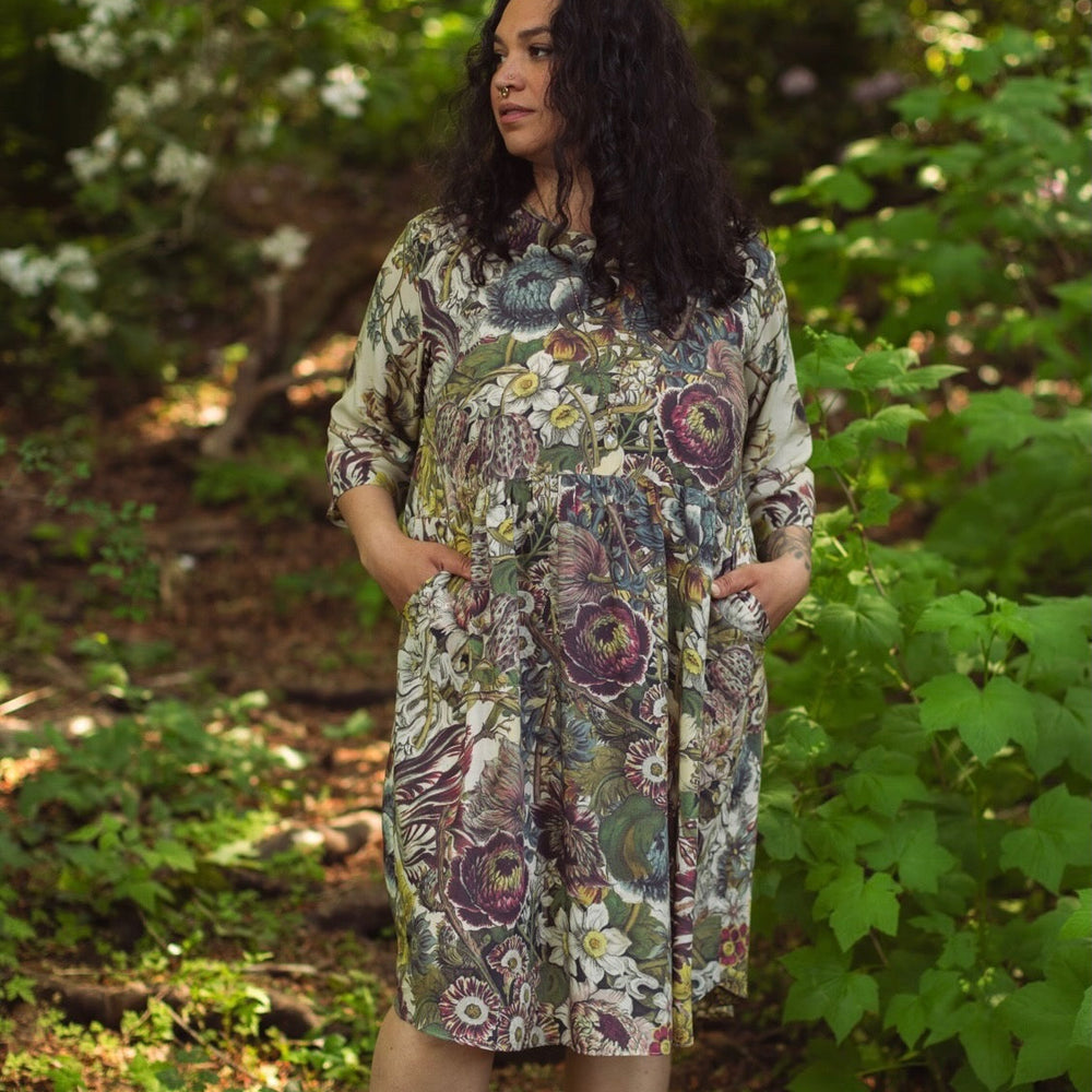 
                  
                    Model styled in Love Grows Wild Artist Dress featuring hand-coloured 1700s floral etchings and bumblebee detail – inspired by the French chemise – Market of Stars
                  
                