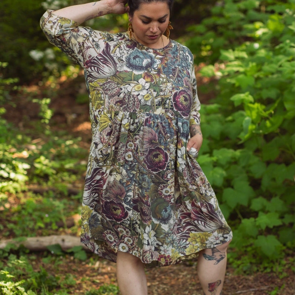 
                  
                    Model styled in Love Grows Wild Artist Dress featuring hand-coloured 1700s floral etchings and bumblebee detail – inspired by the French chemise – Market of Stars
                  
                