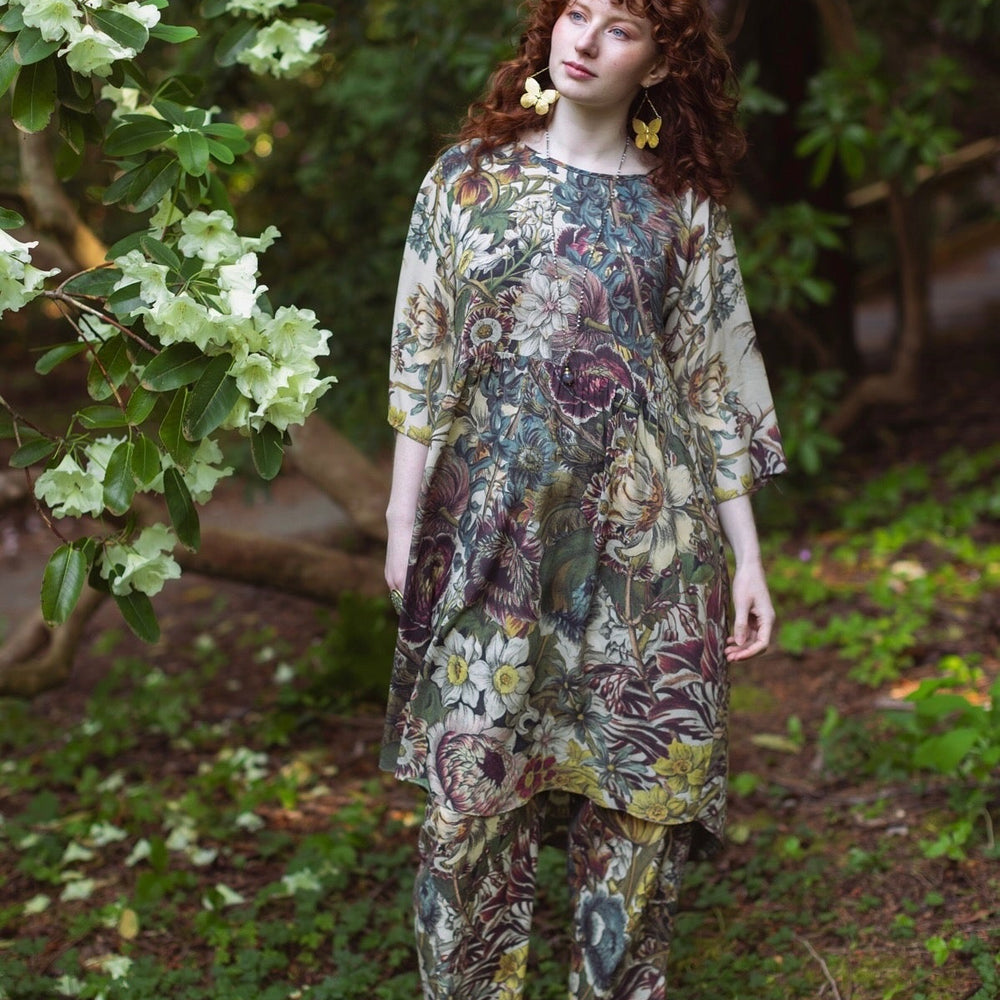 
                  
                    Model styled in Love Grows Wild Artist Dress featuring hand-coloured 1700s floral etchings and bumblebee detail – inspired by the French chemise – Market of Stars
                  
                