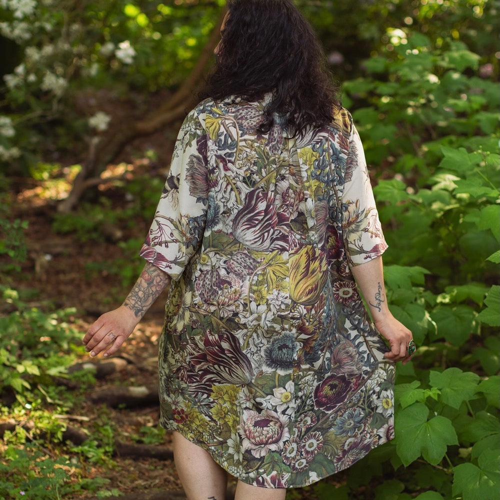 
                  
                    Model styled in Love Grows Wild Artist Dress featuring hand-coloured 1700s floral etchings and bumblebee detail – inspired by the French chemise – Market of Stars
                  
                
