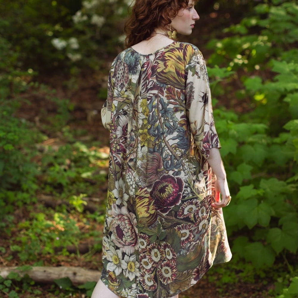
                  
                    Model styled in Love Grows Wild Artist Dress featuring hand-coloured 1700s floral etchings and bumblebee detail – inspired by the French chemise – Market of Stars
                  
                