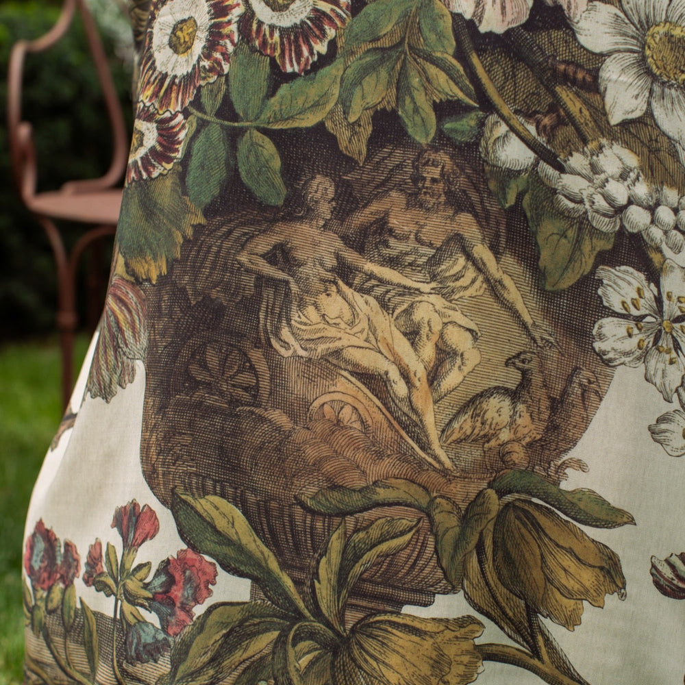 
                  
                    Model wearing kimono featuring 1700s March floral etchings and charming bumblebee trim inspired by vintage seed catalogues – Market of Stars.
                  
                