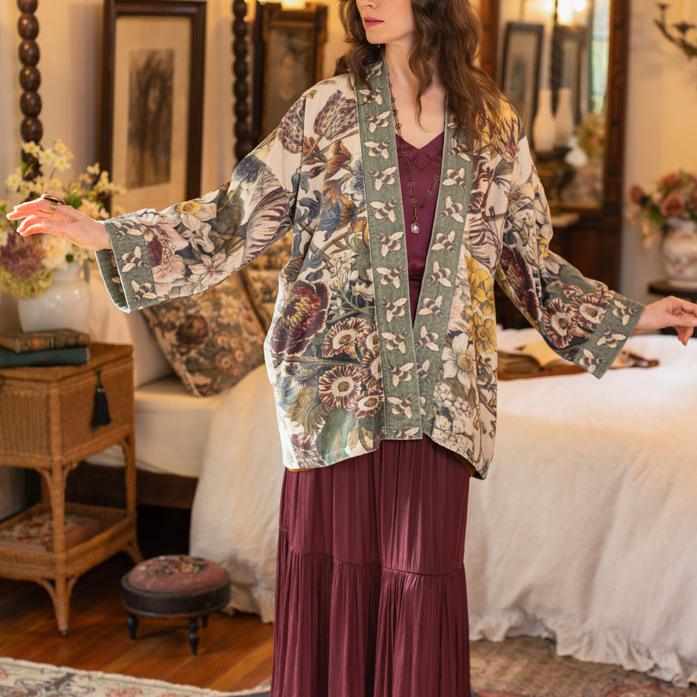 Model wearing a soft cotton velvet duster featuring lush 1700s botanical blooms and bumblebee trim - Market of Stars