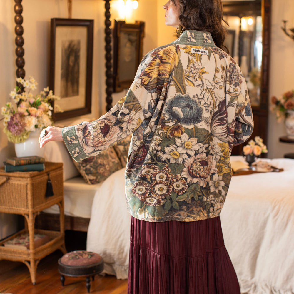 Model wearing a soft cotton velvet duster featuring lush 1700s botanical blooms and bumblebee trim - Market of Stars