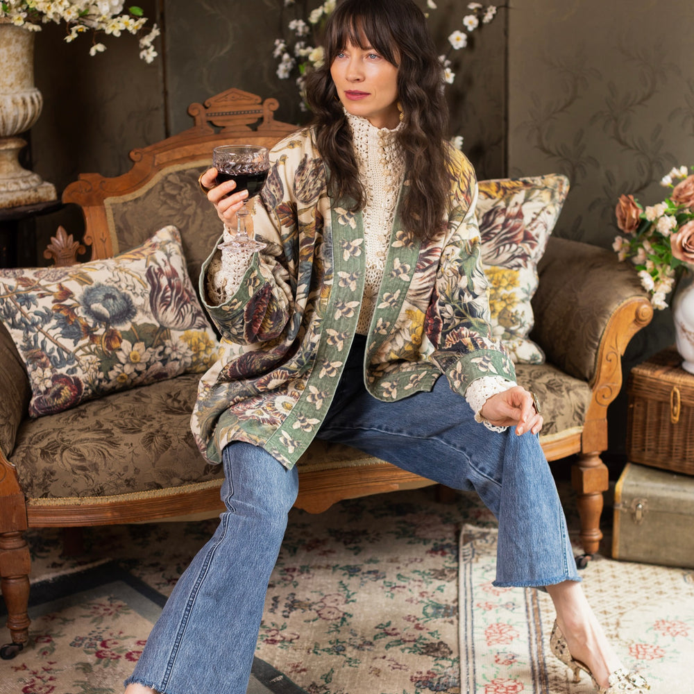 
                  
                    Model wearing a soft cotton velvet duster featuring lush 1700s botanical blooms and bumblebee trim - Market of Stars
                  
                