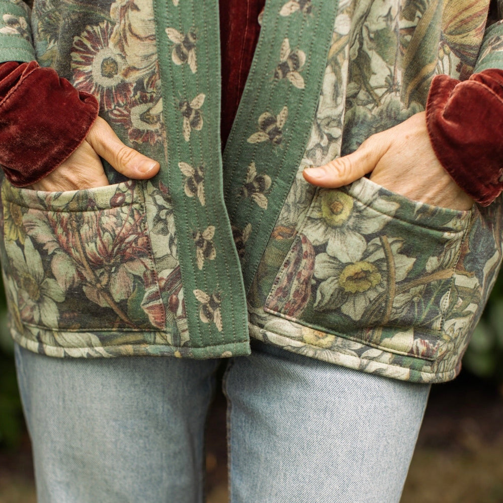 
                  
                    Love Grows Wild Cottage Cardigan featuring 1700s floral etchings and bumblebee trim – cozy fleece-lined cardigan perfect for cooler days – Market of Stars.
                  
                