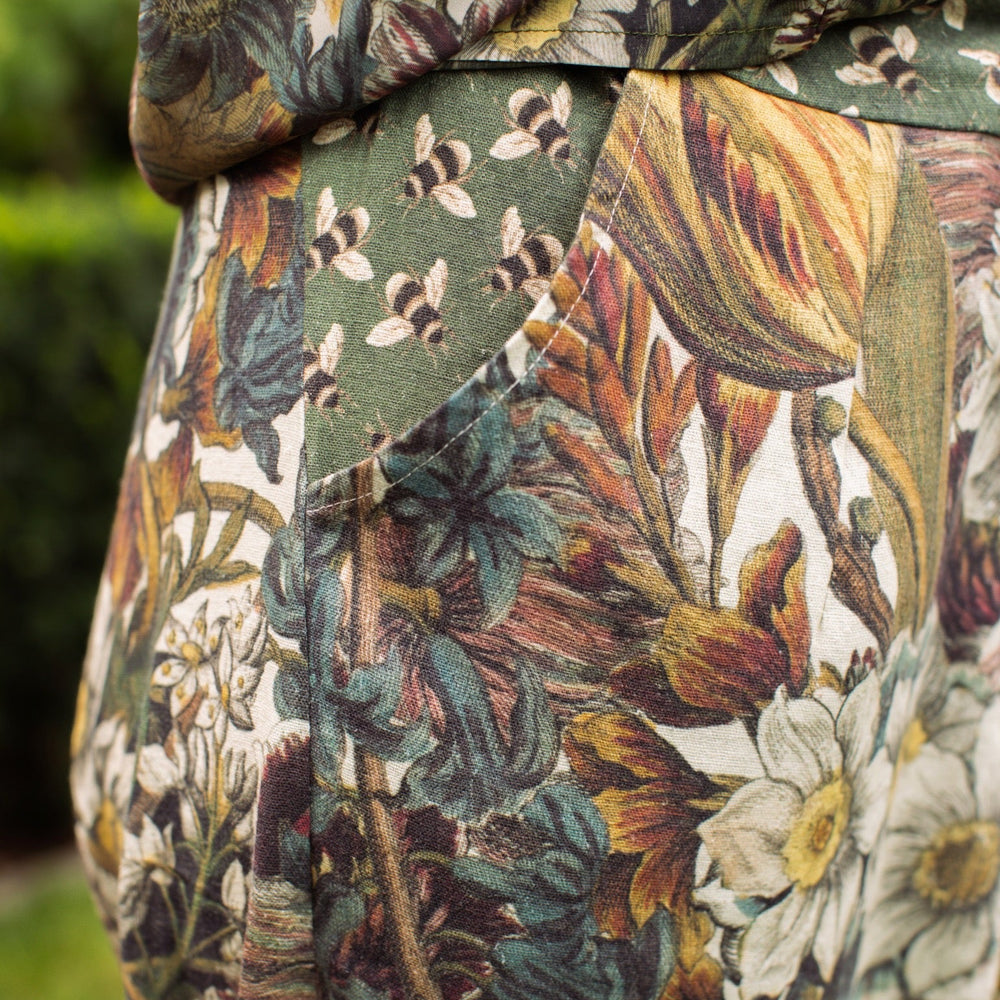 
                  
                    Model styled in Love Grows Wild Artist Pants featuring 1700s hand-coloured floral etchings and bumblebee trim – relaxed lantern hem and cropped fit – Market of Stars
                  
                