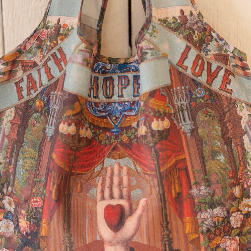 
                  
                    Tote bag featuring joyful 1854 floral artwork, heart-in-hand symbol, and vintage love notes, designed for everyday adventures – Market of Stars
                  
                
