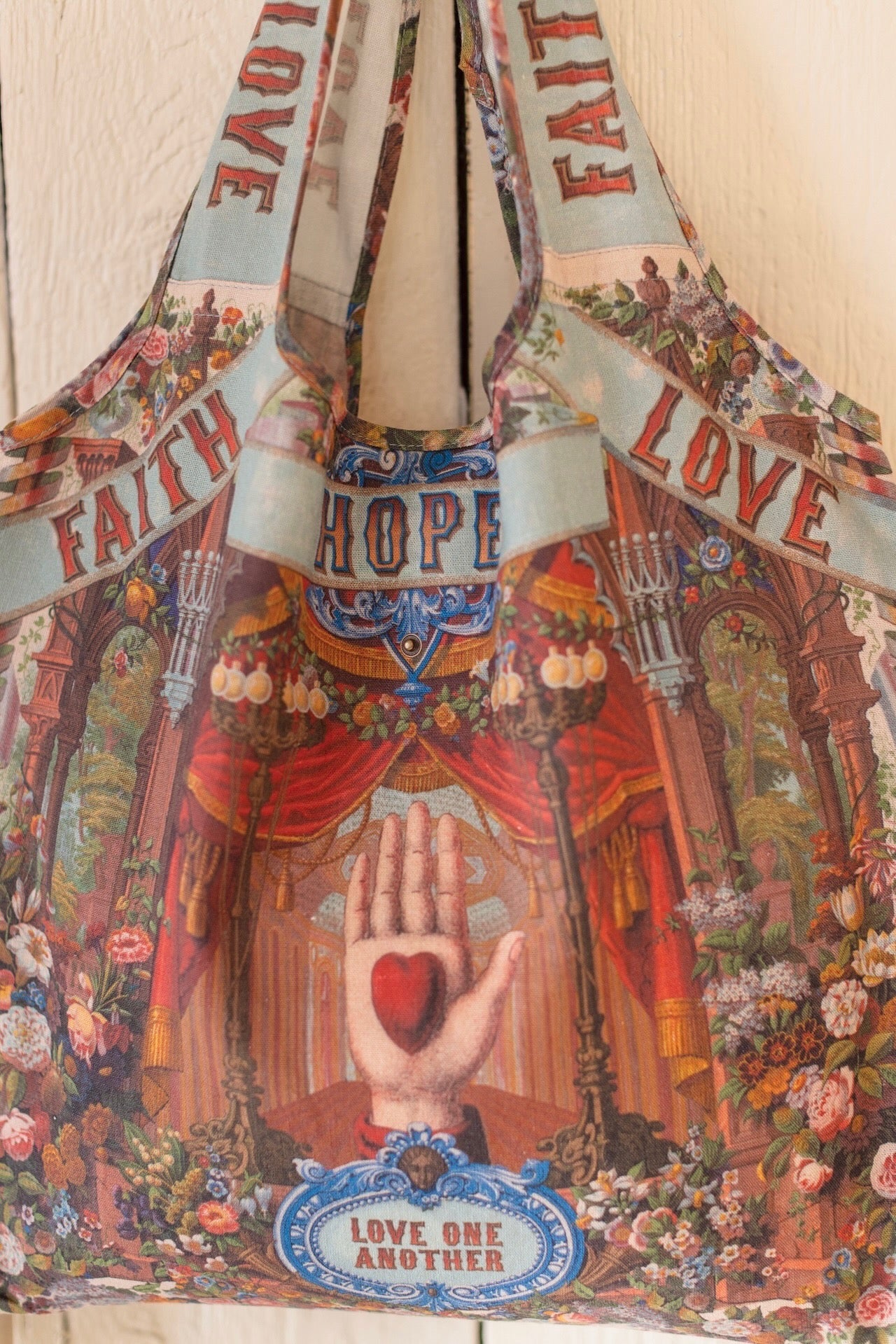Tote bag featuring joyful 1854 floral artwork, heart-in-hand symbol, and vintage love notes, designed for everyday adventures – Market of Stars