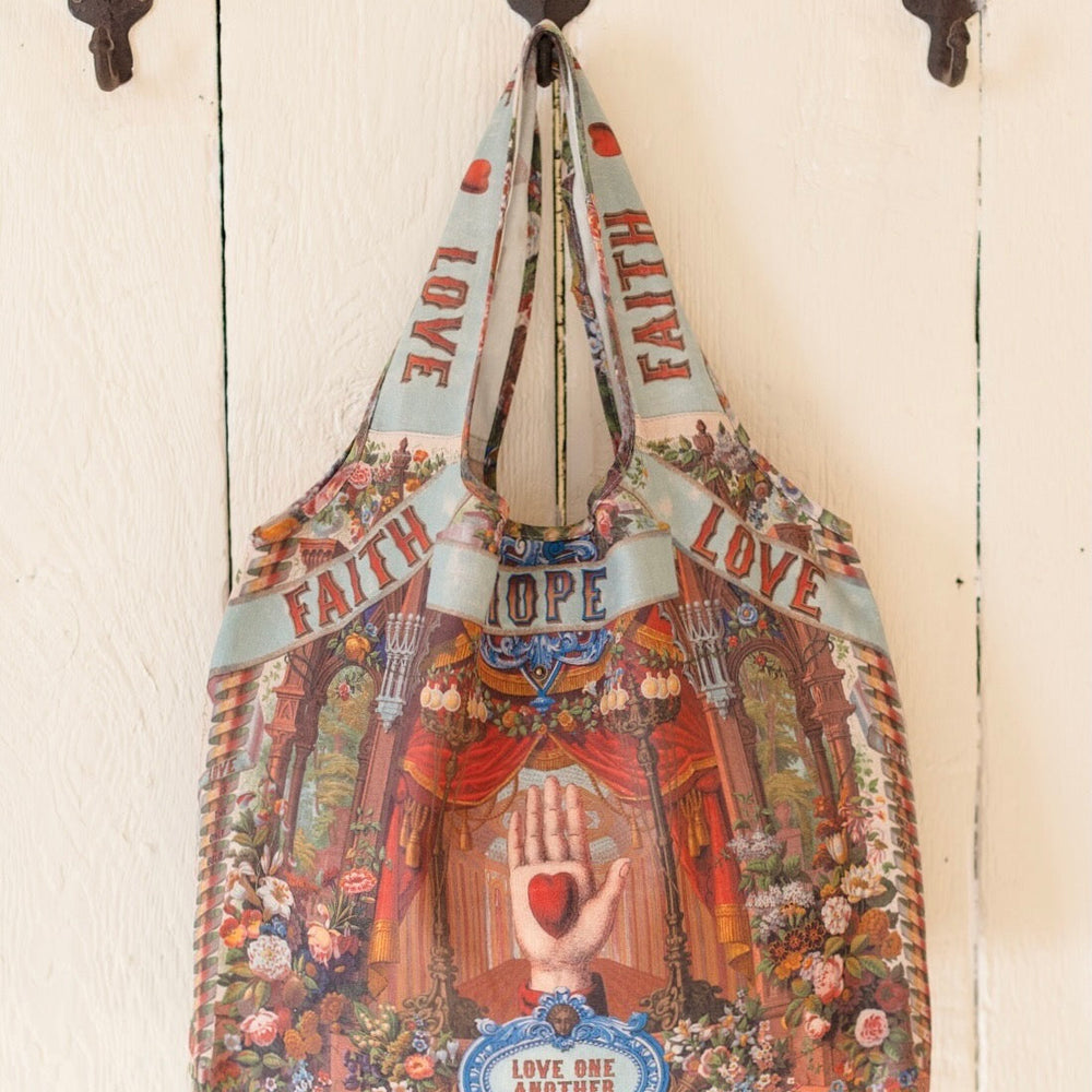 
                  
                    Tote bag featuring joyful 1854 floral artwork, heart-in-hand symbol, and vintage love notes, designed for everyday adventures – Market of Stars
                  
                