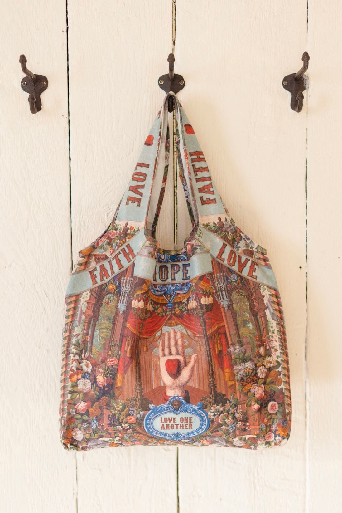 Tote bag featuring joyful 1854 floral artwork, heart-in-hand symbol, and vintage love notes, designed for everyday adventures – Market of Stars