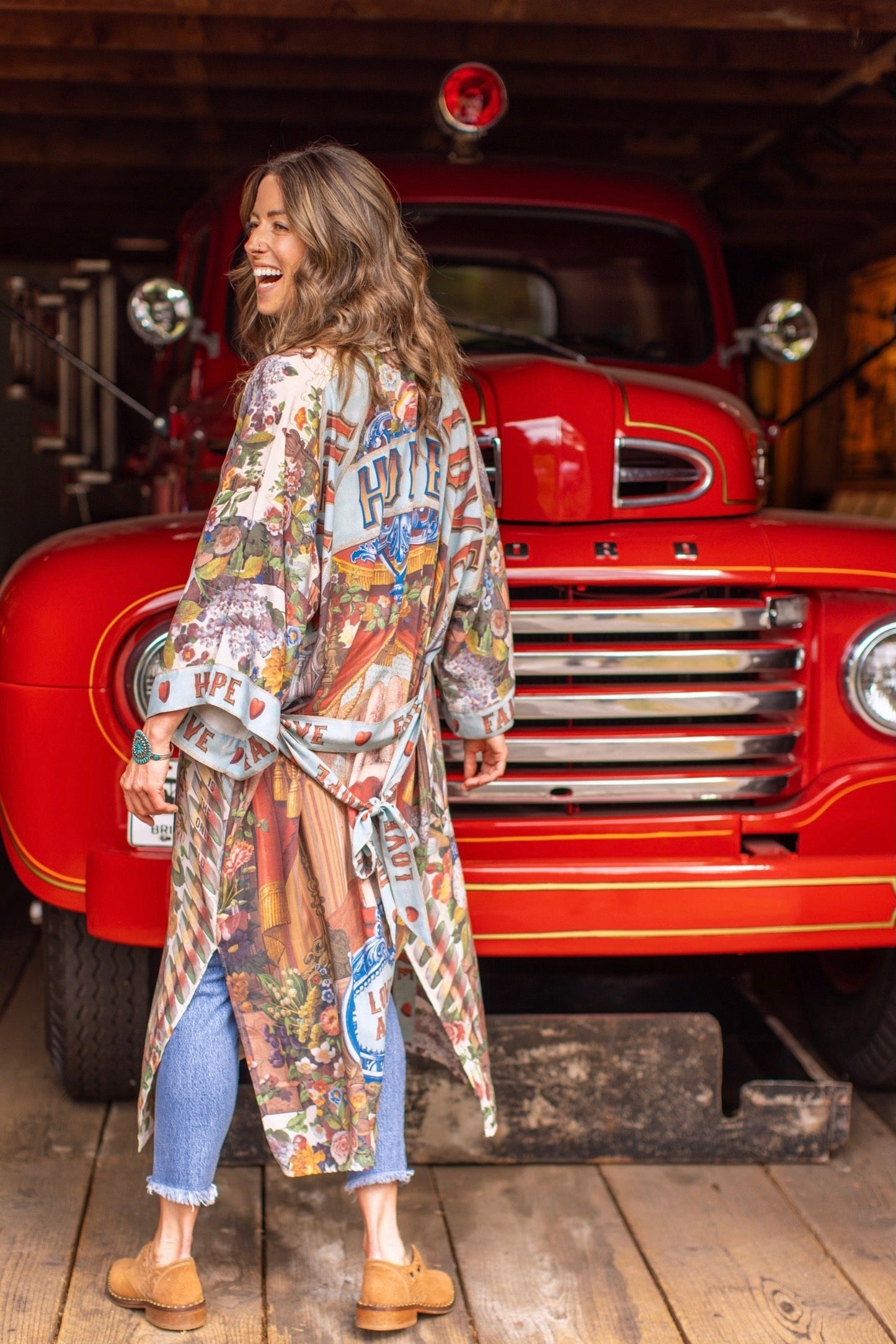 Model wearing romantic full-length kimono featuring joyful 1854 floral art, heart-in-hand symbol, and handwritten messages of love – Market of Stars