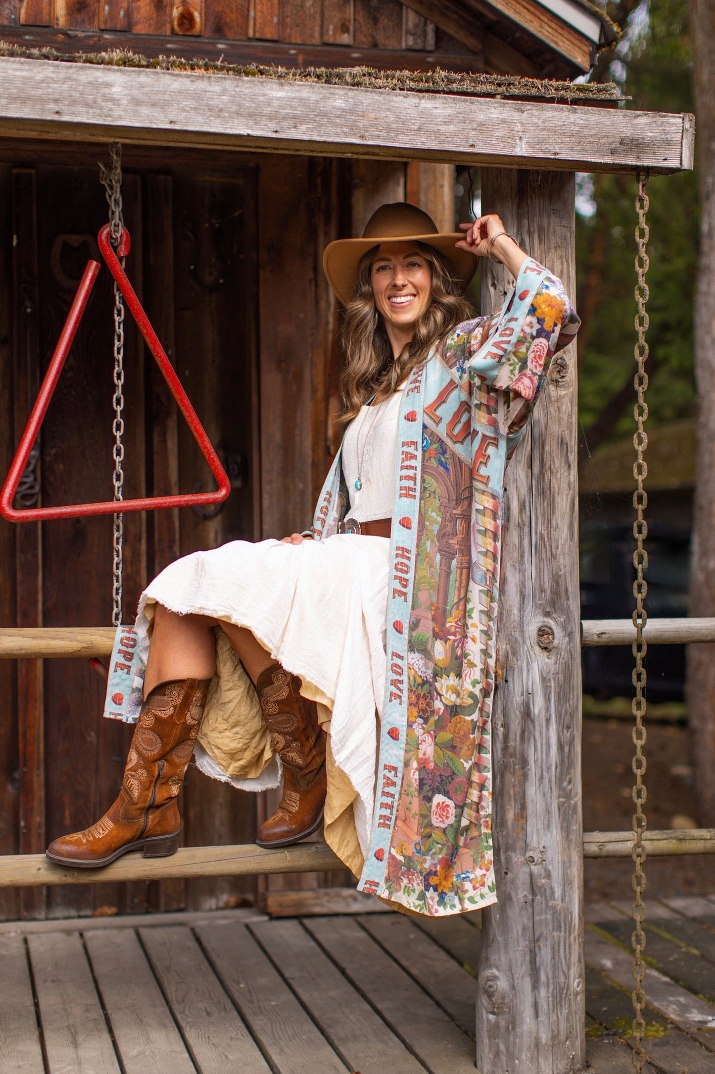 Model wearing romantic full-length kimono featuring joyful 1854 floral art, heart-in-hand symbol, and handwritten messages of love – Market of Stars
