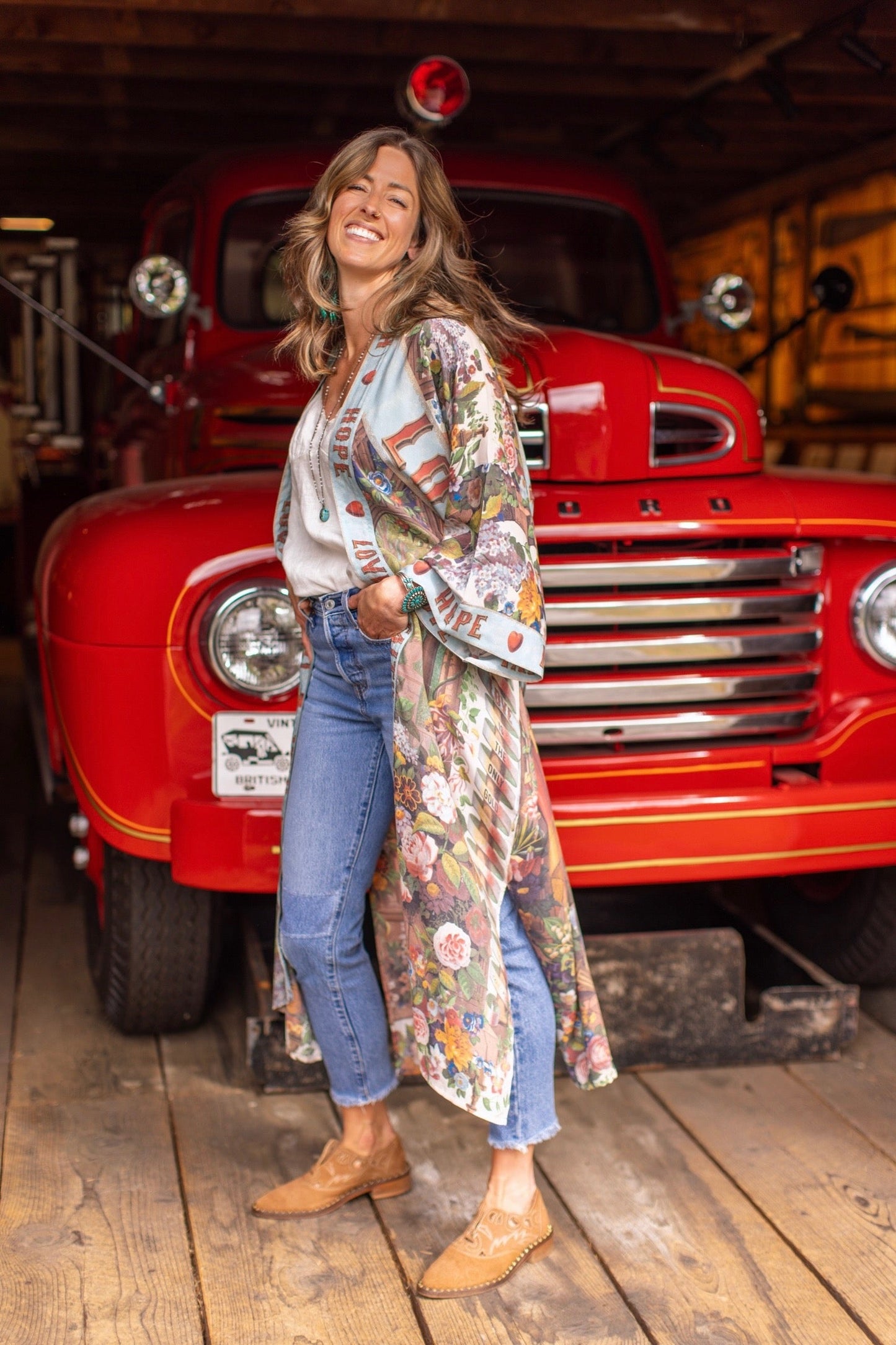 Model wearing romantic full-length kimono featuring joyful 1854 floral art, heart-in-hand symbol, and handwritten messages of love – Market of Stars