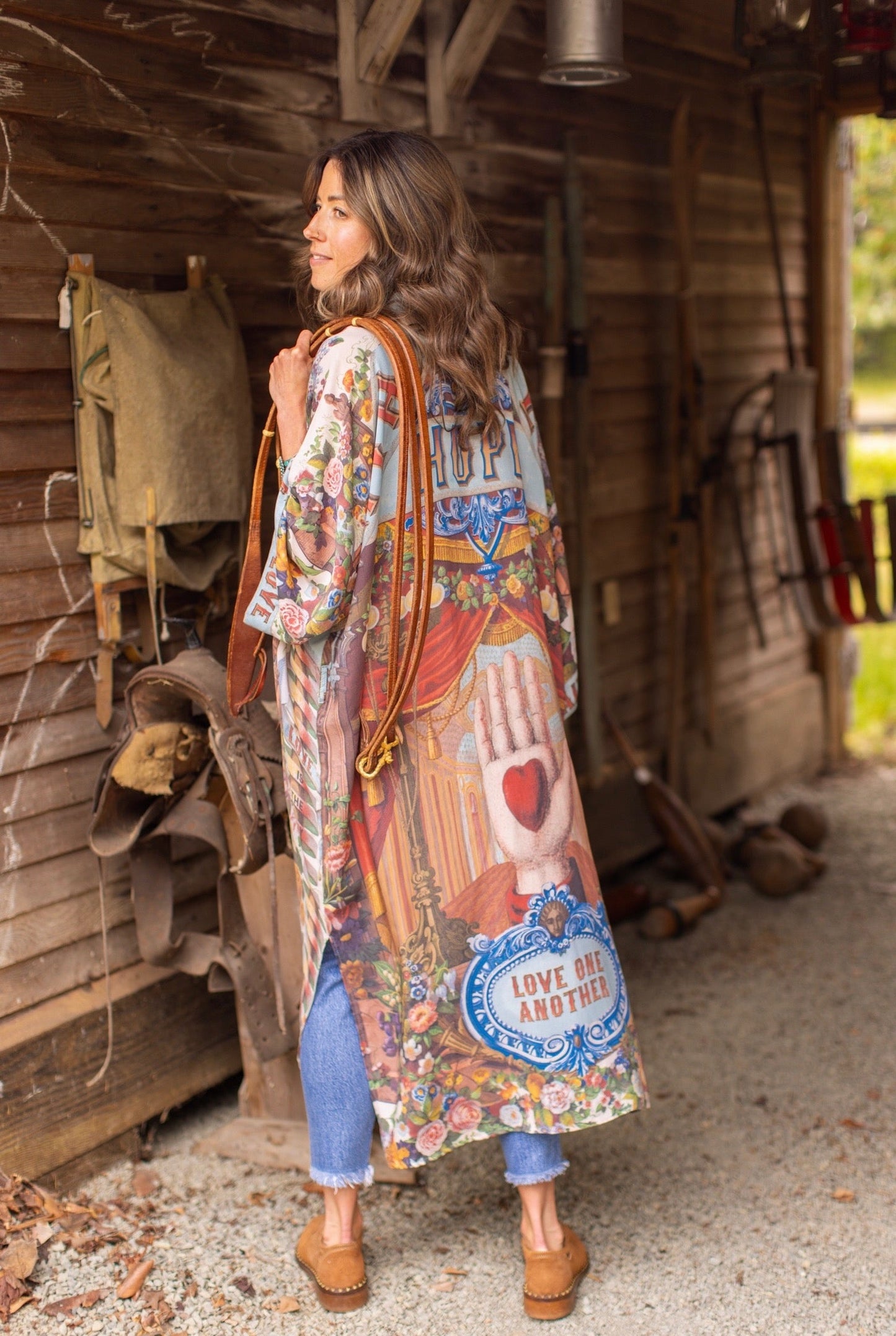 Model wearing romantic full-length kimono featuring joyful 1854 floral art, heart-in-hand symbol, and handwritten messages of love – Market of Stars