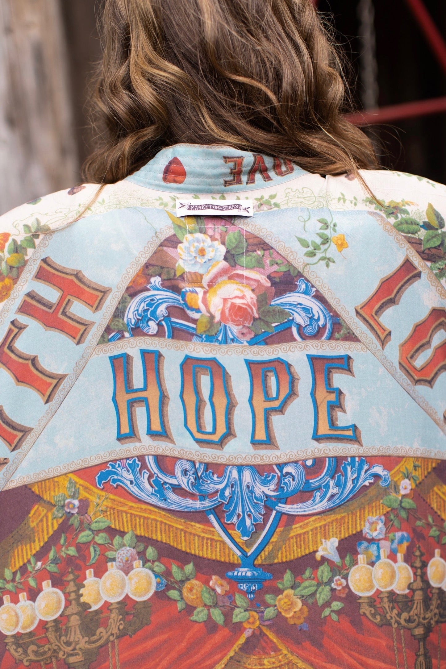 Model wearing romantic full-length kimono featuring joyful 1854 floral art, heart-in-hand symbol, and handwritten messages of love – Market of Stars