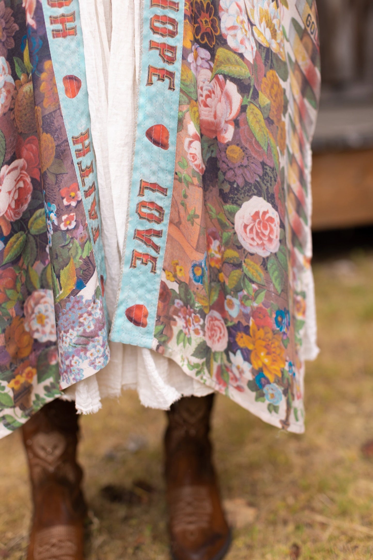 Model wearing romantic full-length kimono featuring joyful 1854 floral art, heart-in-hand symbol, and handwritten messages of love – Market of Stars
