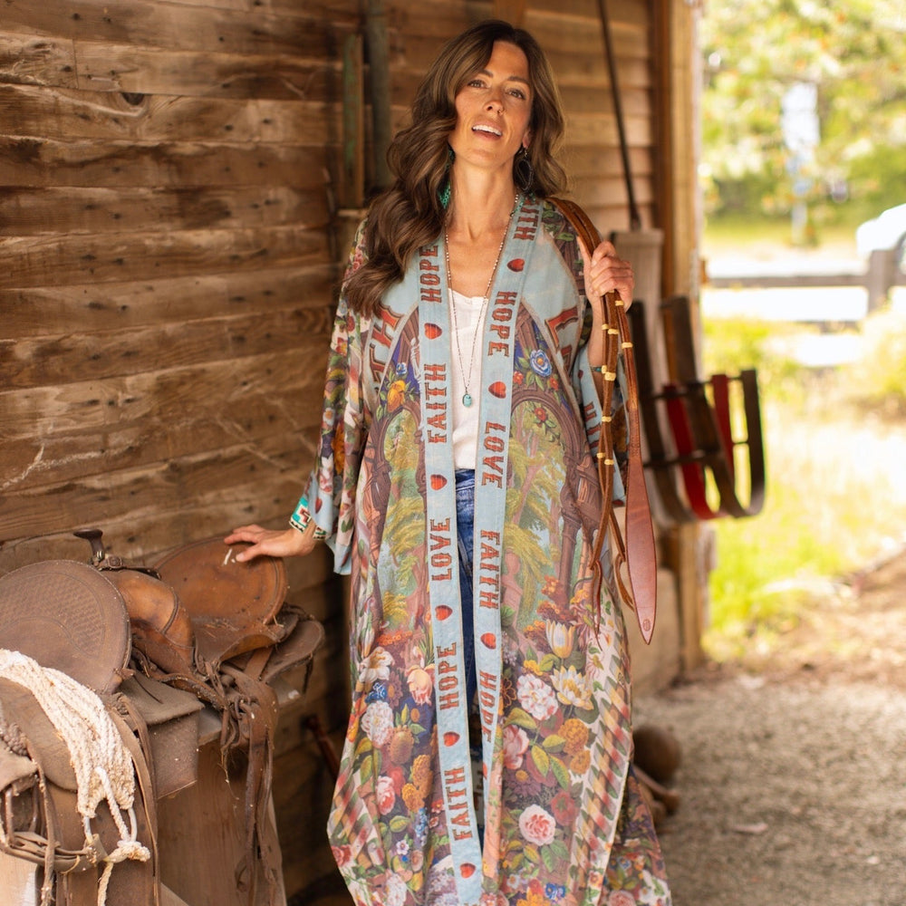 
                  
                    Model wearing romantic full-length kimono featuring joyful 1854 floral art, heart-in-hand symbol, and handwritten messages of love – Market of Stars
                  
                