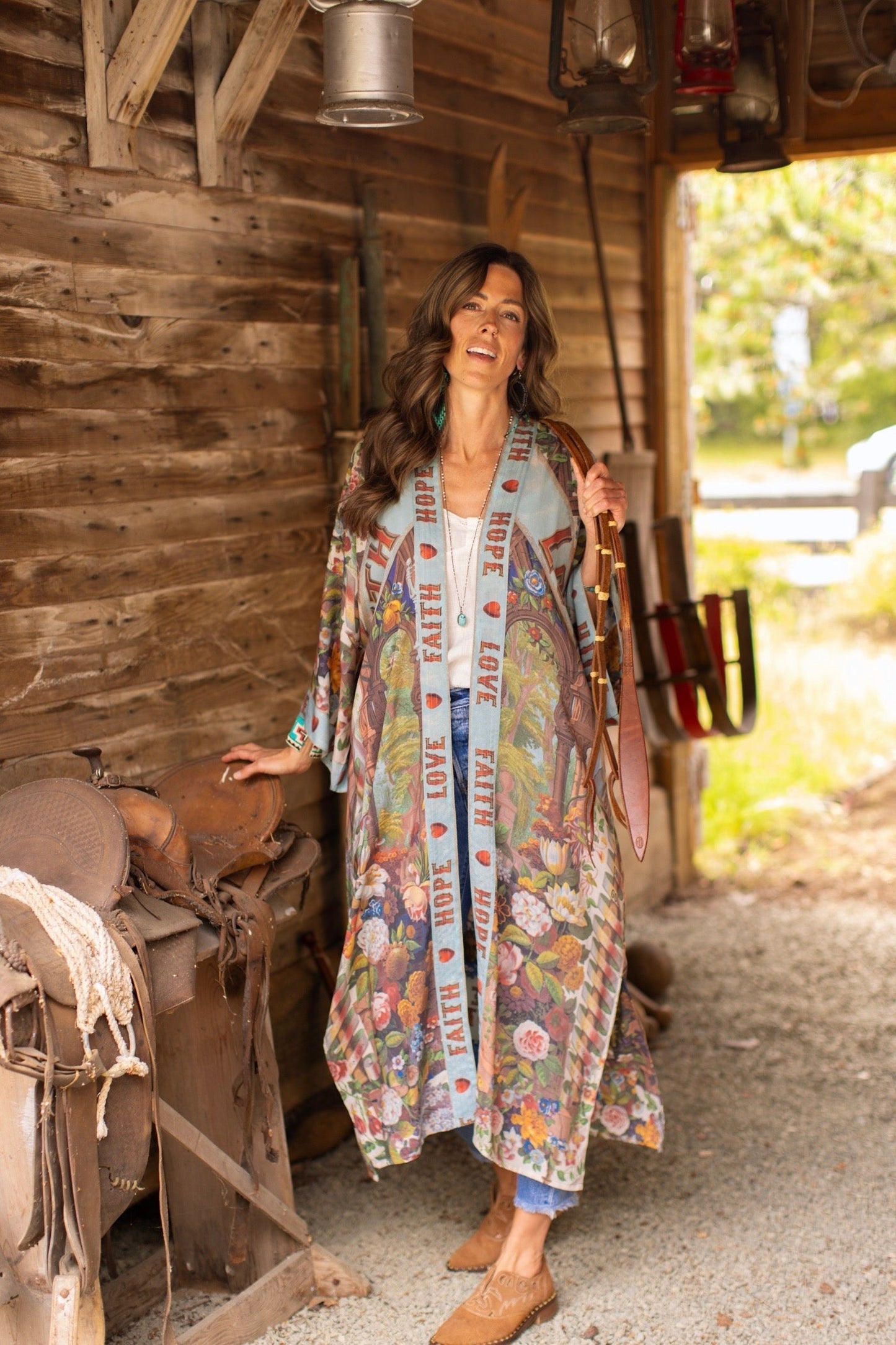 Model wearing romantic full-length kimono featuring joyful 1854 floral art, heart-in-hand symbol, and handwritten messages of love – Market of Stars