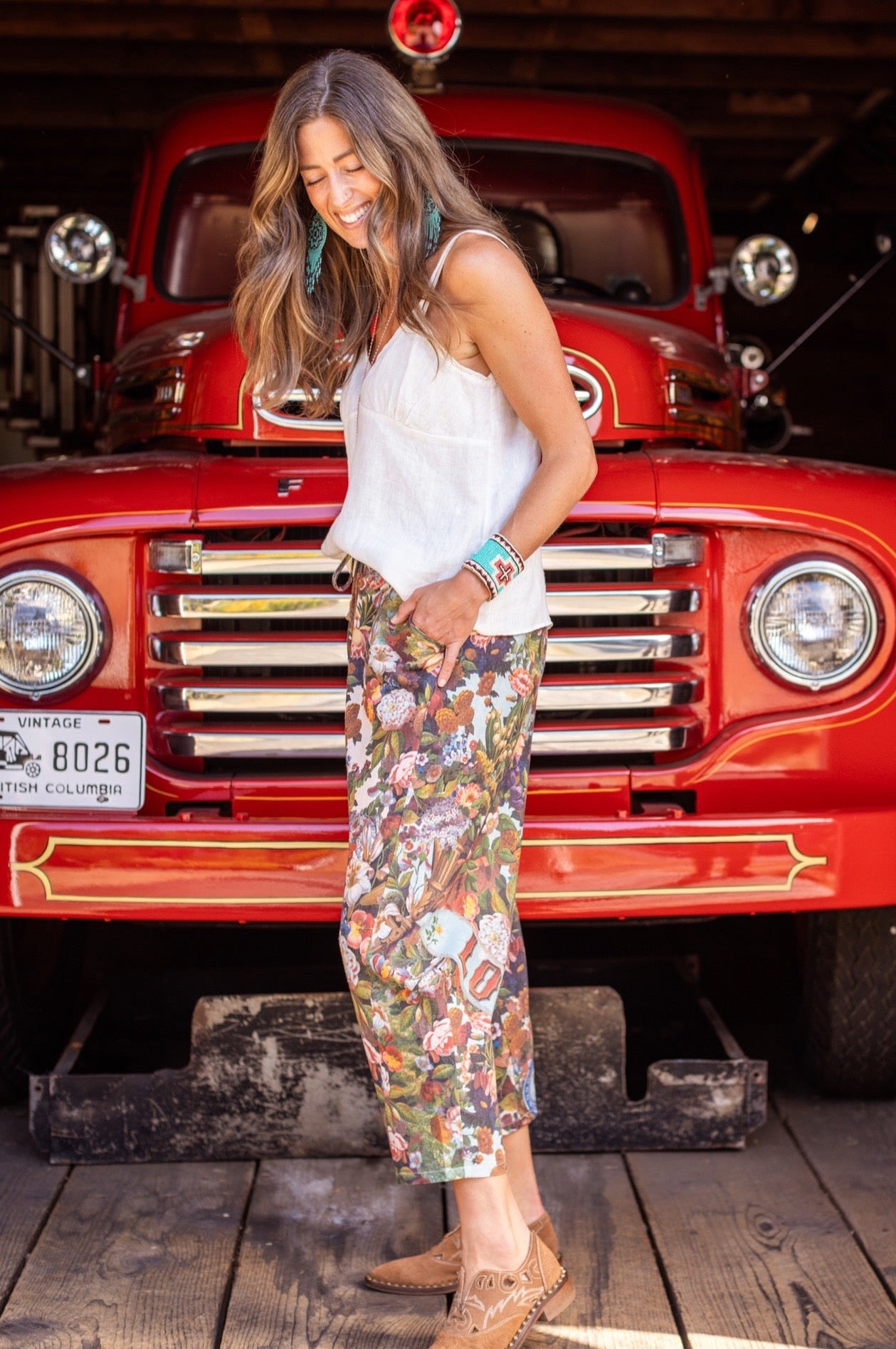 Model wearing linen blend artist pants with 1854 floral art, heart-in-hand symbol, and “Love one another” handwritten script – Market of Stars.