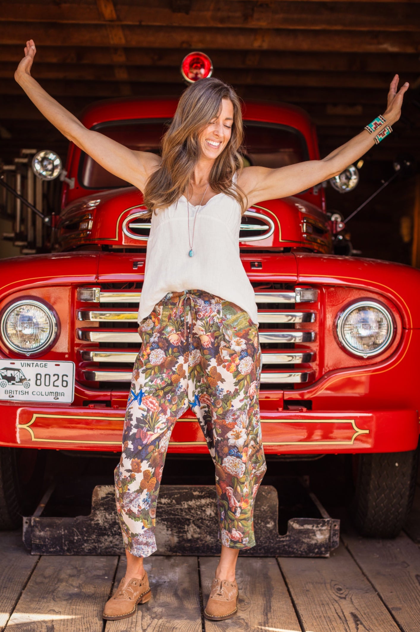 Model wearing linen blend artist pants with 1854 floral art, heart-in-hand symbol, and “Love one another” handwritten script – Market of Stars.