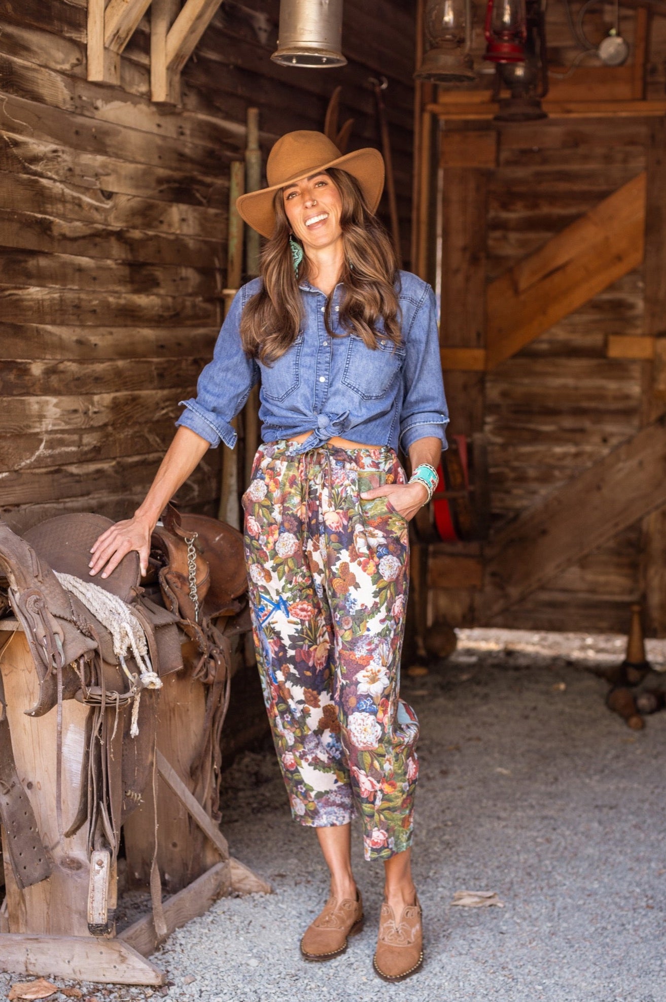 Model wearing linen blend artist pants with 1854 floral art, heart-in-hand symbol, and “Love one another” handwritten script – Market of Stars.
