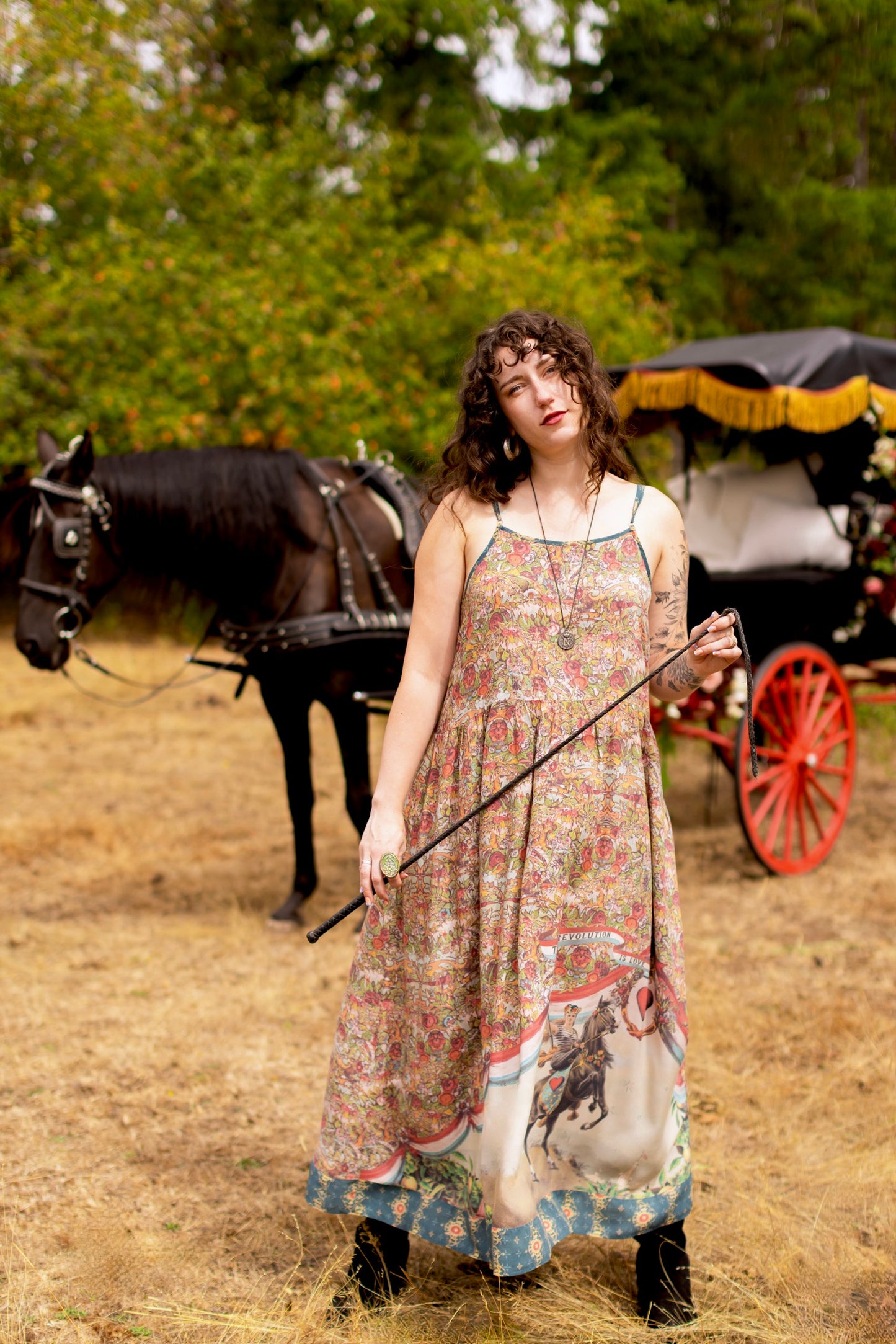 Model wearing a maxi-length slip dress ft. a woman astride a rearing horse, soft vintage florals, rosettes and lithographs from the 1800's - Market of Stars