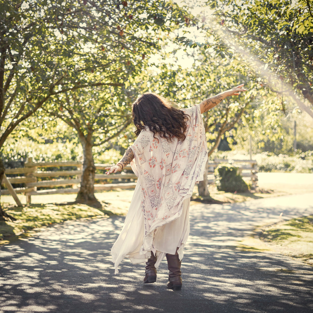 
                  
                    Model wearing romantic kimono with patchwork pattern made from a 200-year-old puzzle purse love letter featuring handwritten poetry and vintage florals – Market of Stars
                  
                