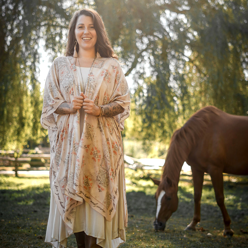 
                  
                    Model wearing romantic kimono with patchwork pattern made from a 200-year-old puzzle purse love letter featuring handwritten poetry and vintage florals – Market of Stars
                  
                