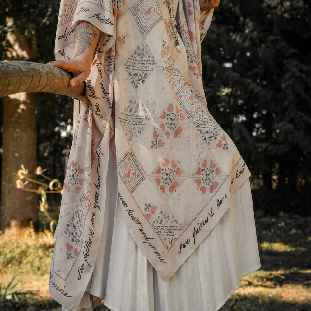 
                  
                    Model wearing romantic kimono with patchwork pattern made from a 200-year-old puzzle purse love letter featuring handwritten poetry and vintage florals – Market of Stars
                  
                