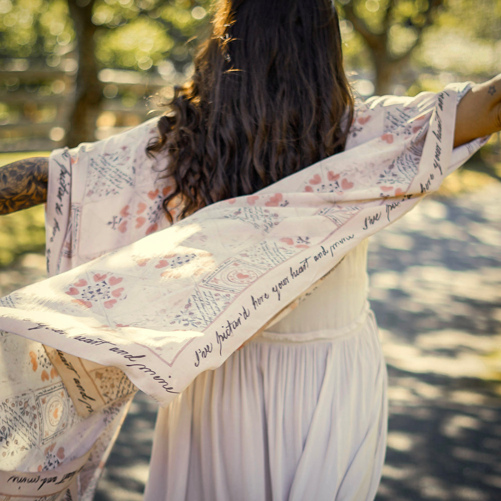 
                  
                    Model wearing romantic kimono with patchwork pattern made from a 200-year-old puzzle purse love letter featuring handwritten poetry and vintage florals – Market of Stars
                  
                