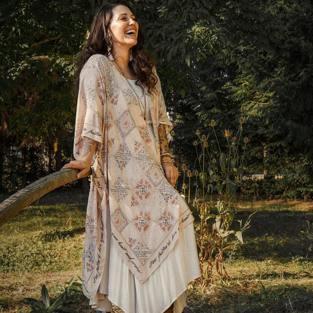 
                  
                    Model wearing romantic kimono with patchwork pattern made from a 200-year-old puzzle purse love letter featuring handwritten poetry and vintage florals – Market of Stars
                  
                