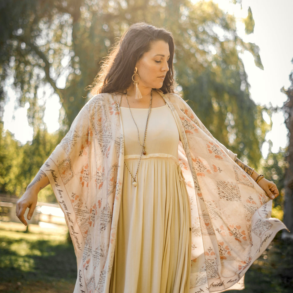 
                  
                    Model wearing romantic kimono with patchwork pattern made from a 200-year-old puzzle purse love letter featuring handwritten poetry and vintage florals – Market of Stars
                  
                
