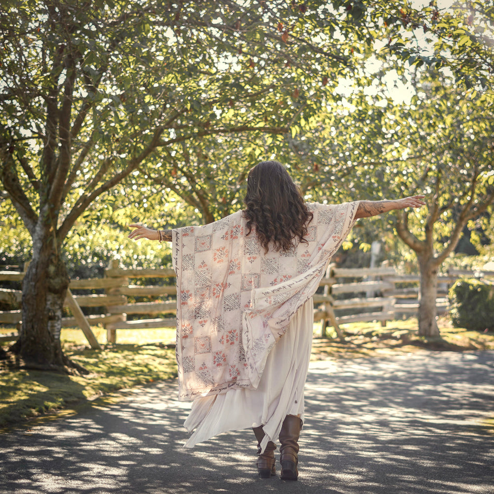 
                  
                    Model wearing romantic kimono with patchwork pattern made from a 200-year-old puzzle purse love letter featuring handwritten poetry and vintage florals – Market of Stars
                  
                