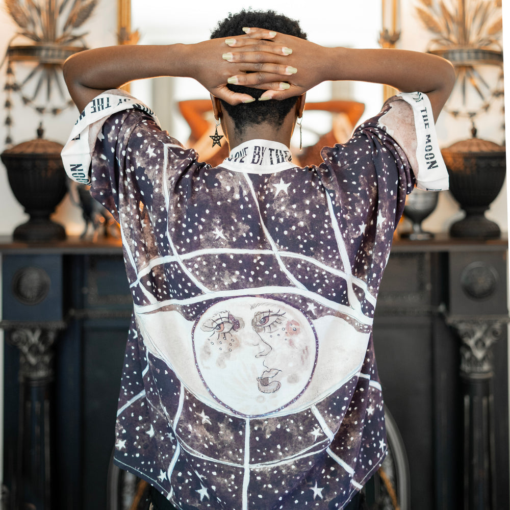 
                  
                    Model wearing Love By The Moon Kimono featuring sepia tones, vintage moon illustration, and retro typography inspired by early 1900s photo props – Market of Stars
                  
                