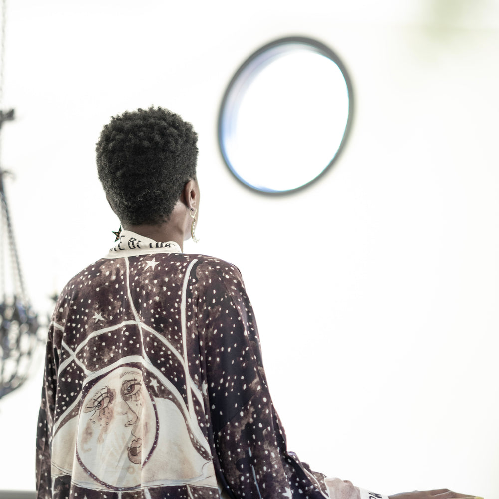 
                  
                    Model wearing Love By The Moon Kimono featuring sepia tones, vintage moon illustration, and retro typography inspired by early 1900s photo props – Market of Stars
                  
                