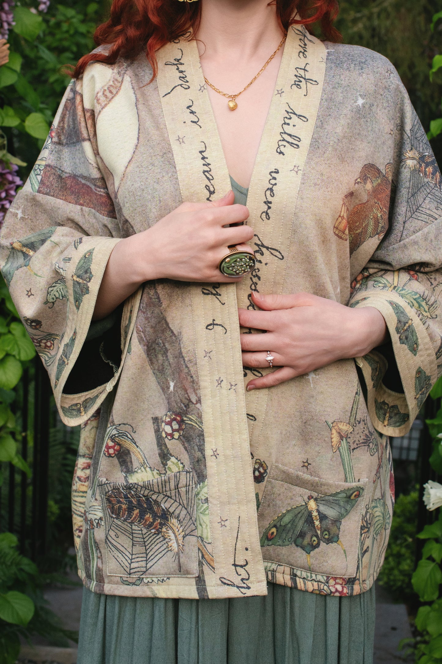Model wearing the Lovelight Cottage Cardigan ft artwork by world-renowned illustrator Charles van Sandwyk - Market of Stars