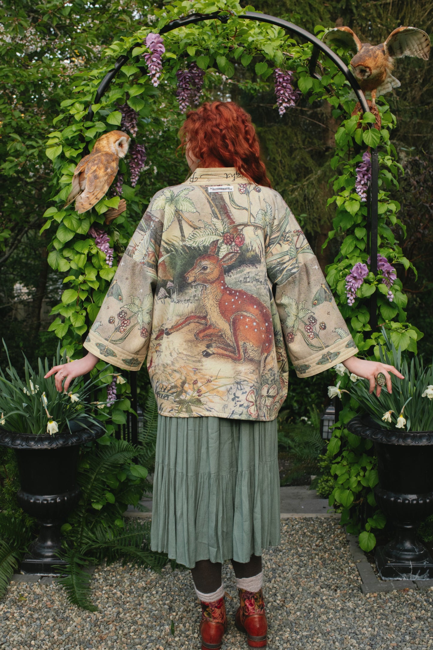 Model wearing the Lovelight Cottage Cardigan ft artwork by world-renowned illustrator Charles van Sandwyk - Market of Stars